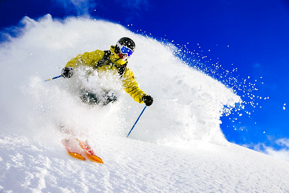 A man skiing fresh powder. Alta, Utah