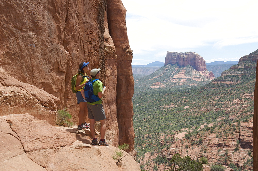 Day hikers at the Cathedral Rock vortex in Sedona, Arizona May 2011.  Easy 1.5-mile hike leads to the saddle between The Mace and The Cathedral giving views to all of Sedona's monuments.