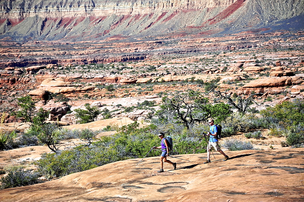 Hikers on the sandstone Esplanade of the Thunder River Trail below the North Rim of the Grand Canyon outside Fredonia, Arizona November 2011. The 21.4-mile loop descends 2000-feet in 2.5-miles through Coconino Sandstone from the Bill Hall trailhead to connect the Thunder River and Deer Creeks trails.  Hikers descend into the lower canyon through a break in the 400-foot-tall Redwall to access Surprise Valley, Deer Creek, Tapeats Creek via Thunder River and even the Colorado River.