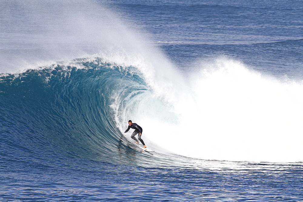 Surfer riding a big hollow perfect wave. Fuerteventura, Canary Islands