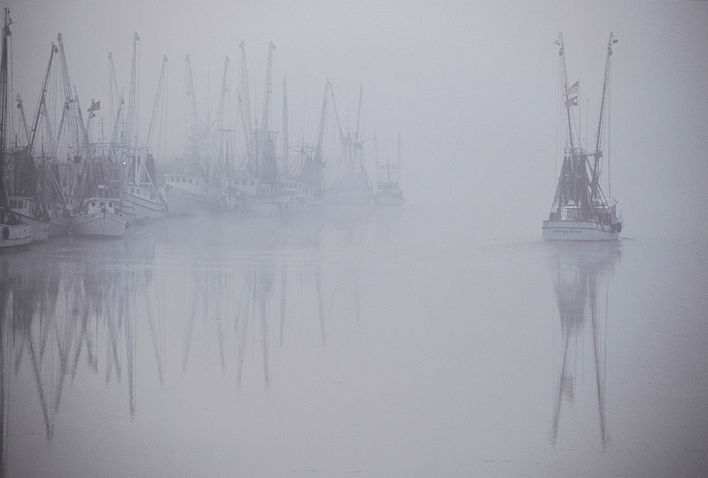 A hazy view of shrimp boats in Darien, Georgia, USA,