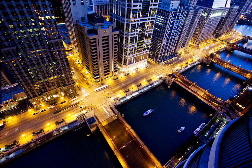 An aerial view of a busy intersection in a large city at dusk, United States of America