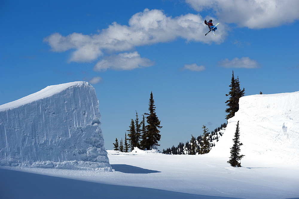 A snowboarder  clears a gap jump in British Columbia.