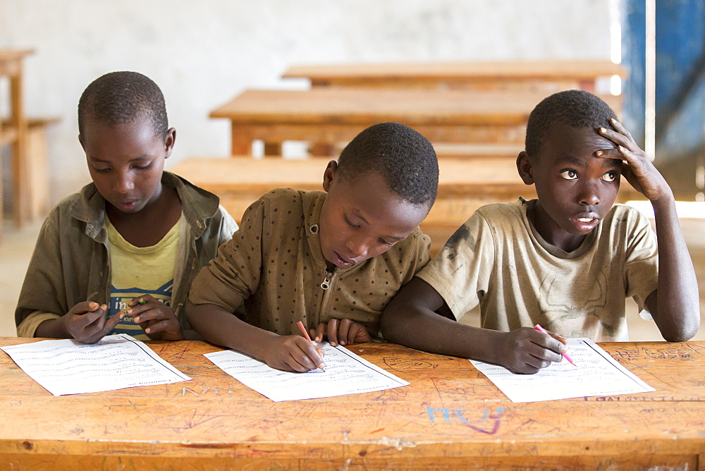 Students work on an assignment at the Kiziba Refugee Camp in Kibuye, Rwanda.