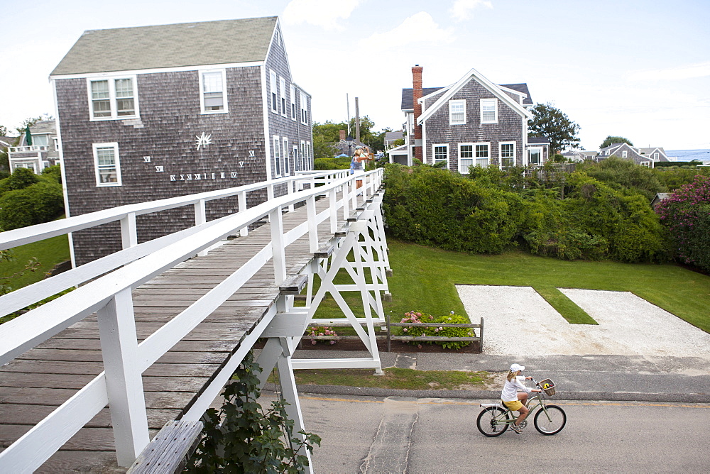 A bicyclist comes out after passing under the Siasconset foot bridge in Siasconset on the island of Nantucket.  08/18/14 Julia Cumes for the Boston Globe