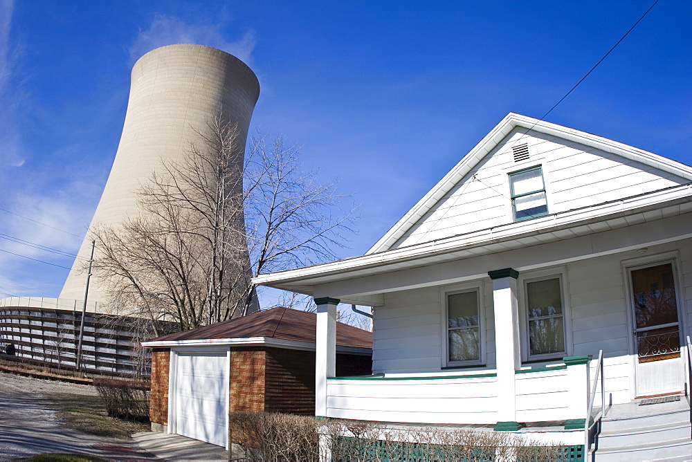 A nuclear silo stretches up into the sky behind an Indiana neighborhood. Photo by Thomas Kranzle, United States of America