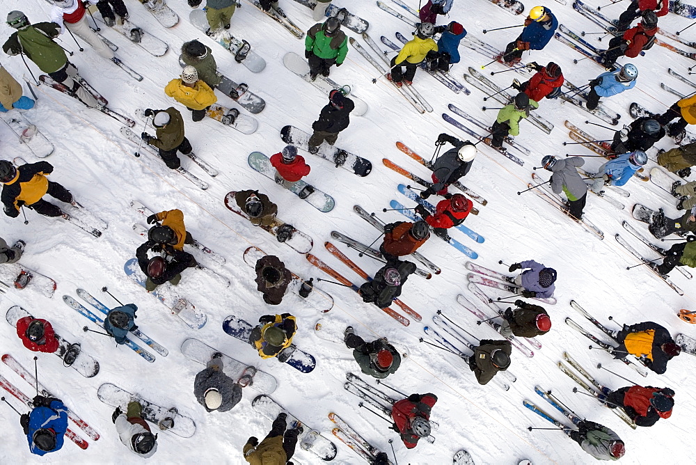 Aerial view of skiers and snowboarders standing in lift line at Mount Hood Meadows ski resort in Oregon Cascades, United States of America