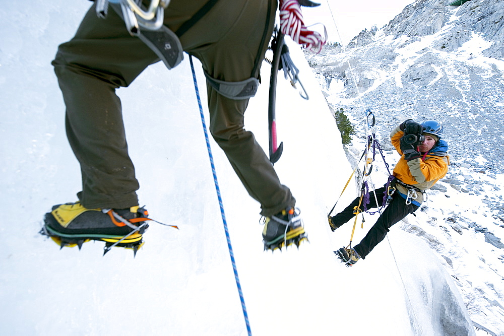 Corey Rich photographs Zach Fletcher while ice climbing in Lee Vining, CA, United States of America