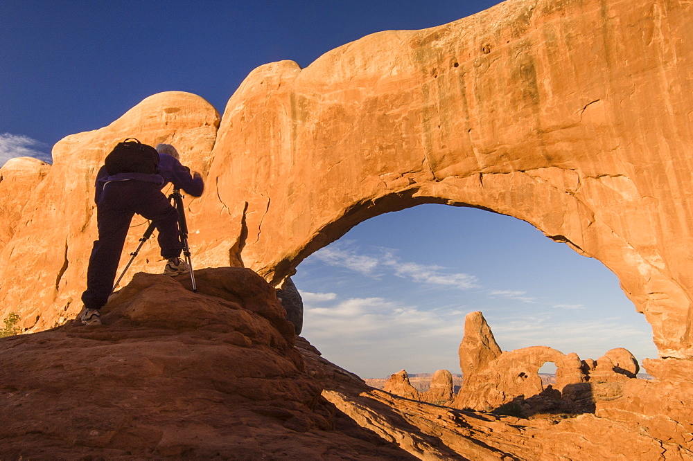 Photographer photographing Windows Arch, Arches National Park