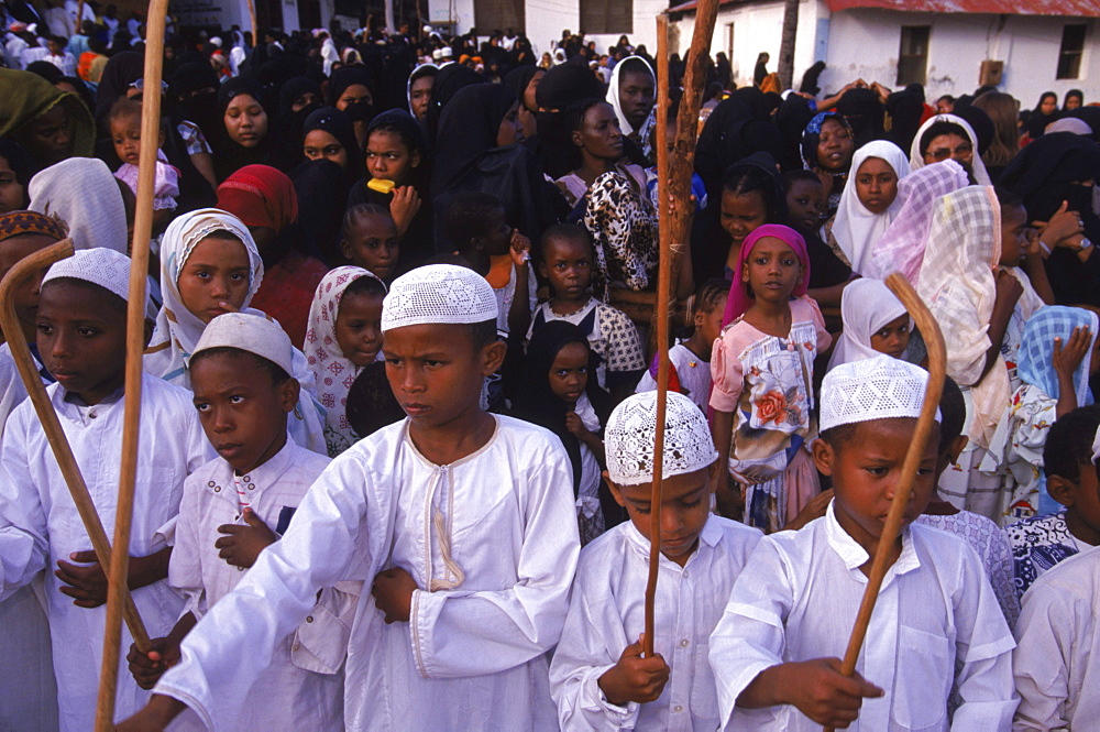 Swahili boys performing the stick dance at a celebration of Maulidi, the birthday of the porphet Mohammed. Lamu Island, Kenya