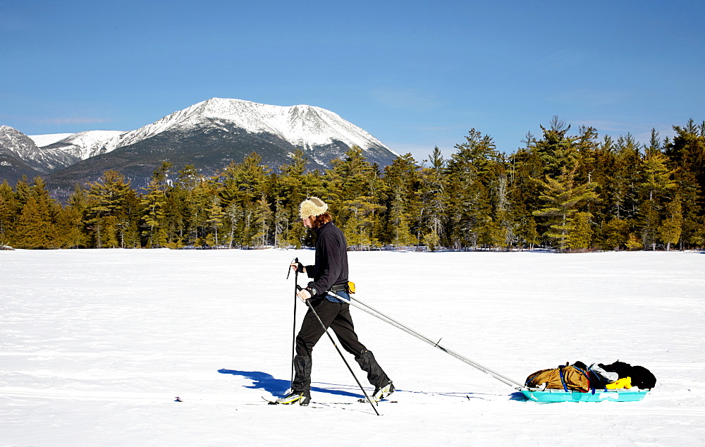 Man cross country skiing in Baxter State Park