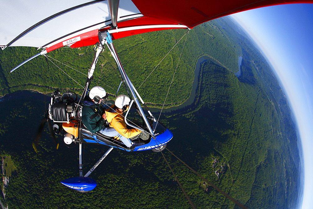 An Light Sport aircraft flies over the New River Gorge, WV