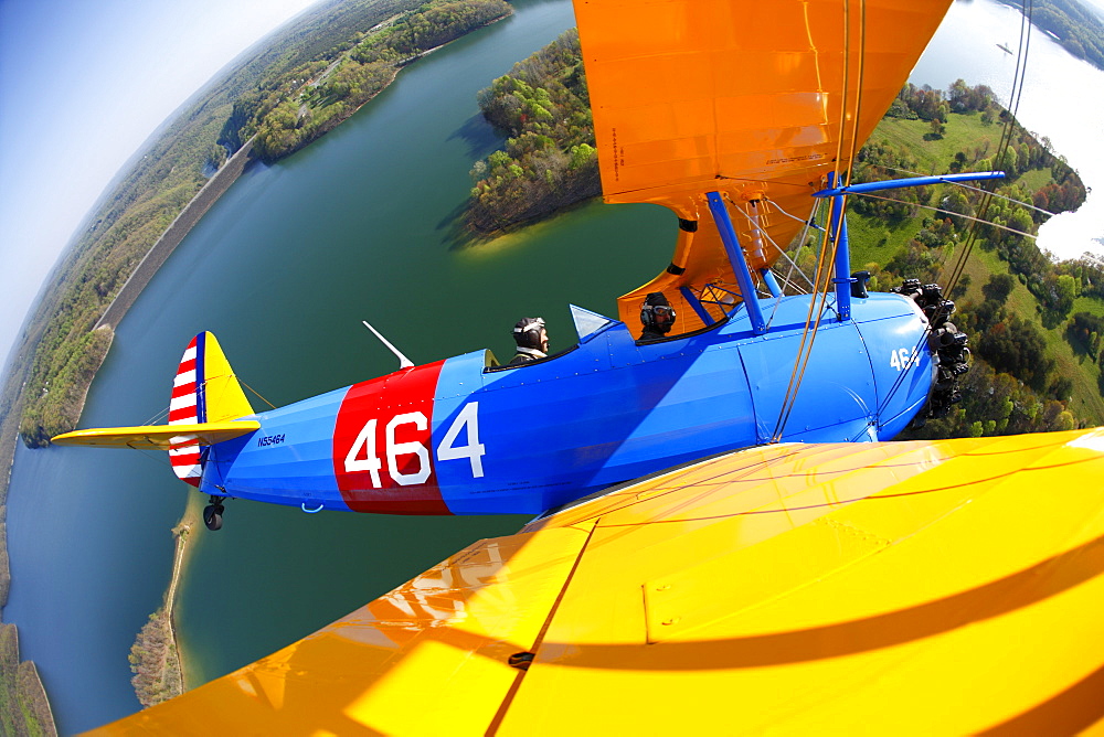 1941 Stearman biplane flying over Summersville Lake near Fayetteville, WV