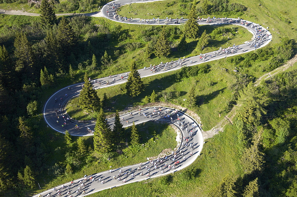 Aerial view of the road up to Passo Pordoi (2239 m), the second pass of the Maratona dles Dolomites bikerace. The race is held o