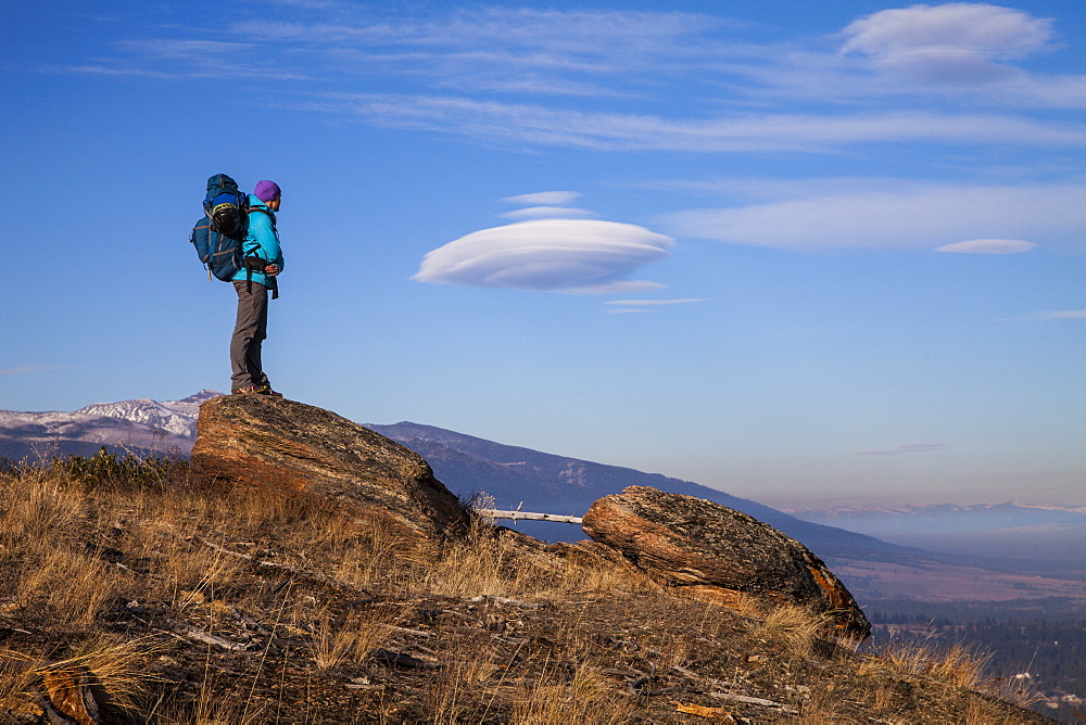 Woman standing on rock in Bitteroot Valley, Montana