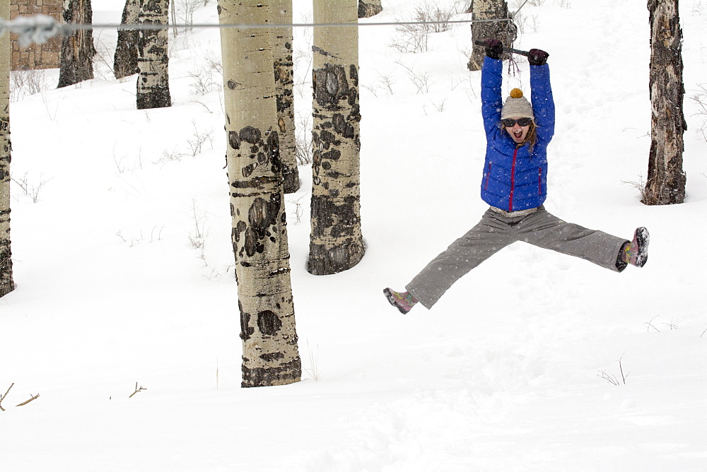 A girl riding a zipline, Telluride, Colorado.