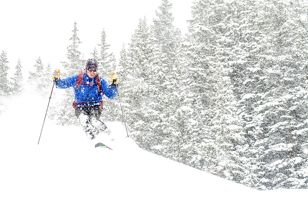 A man backcountry skiing  above Red Mountain Pass, Silverton, Colorado.