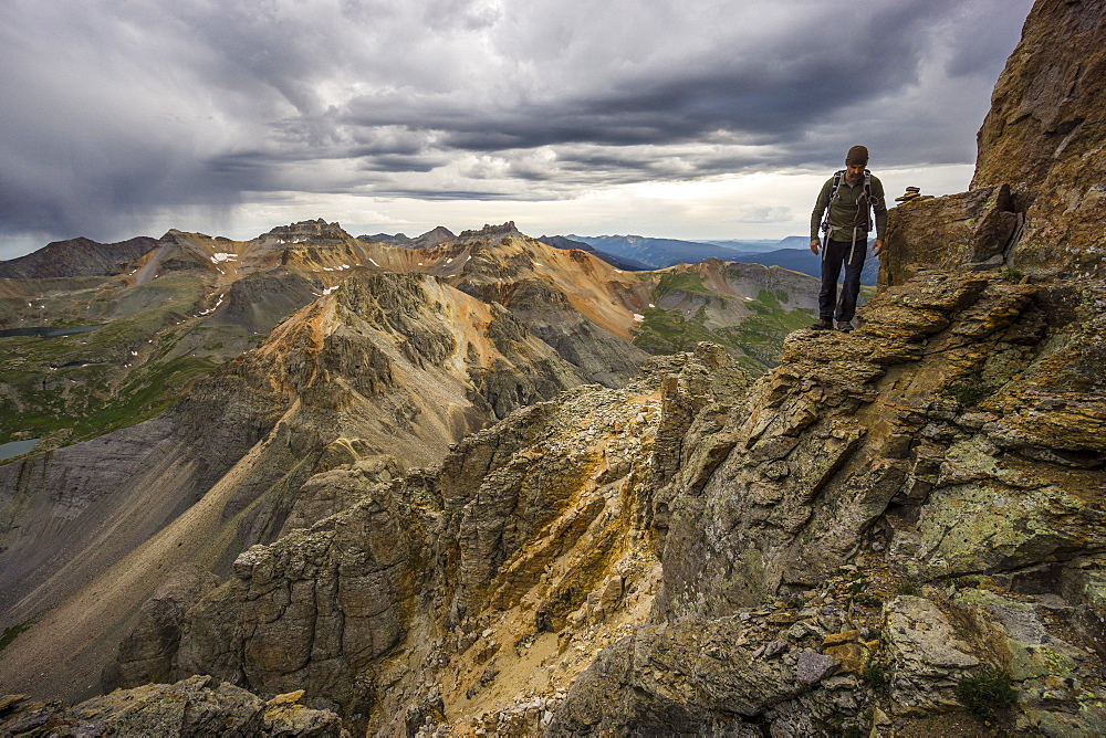 Man climbing a mountain.