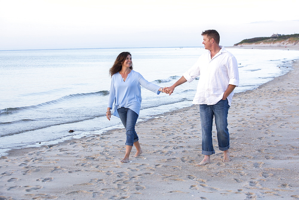 A couple are photographed at a Cape Cod beach, Dennis, Massachusetts, United States of America