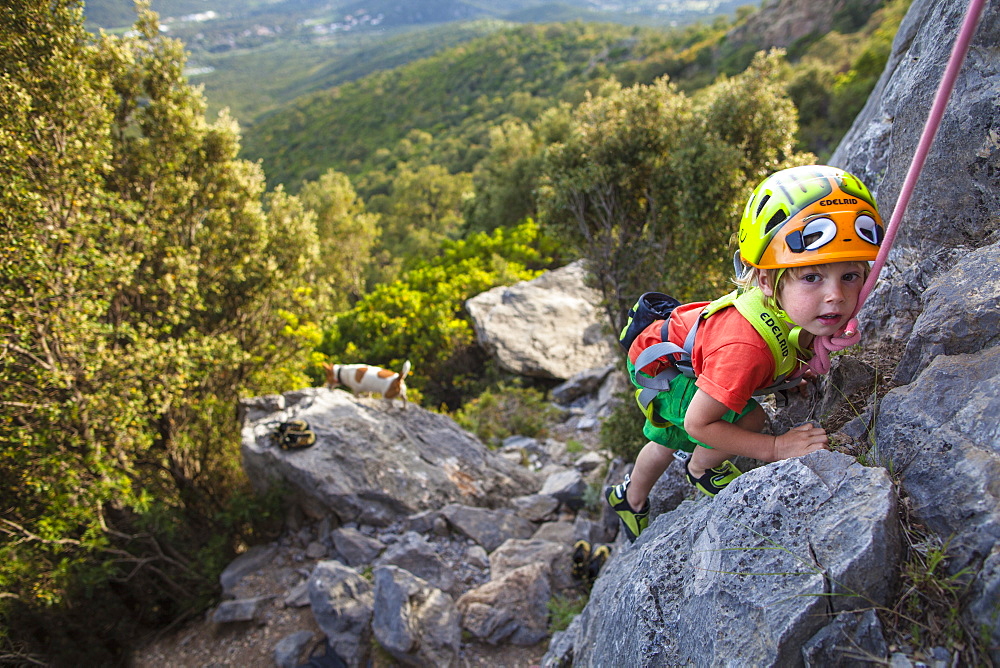 A little boy, a little climber in Corsica. 3 years old.