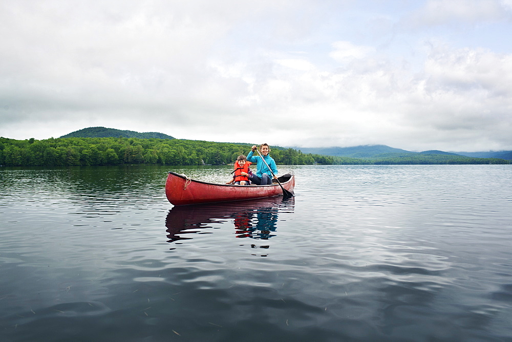 Mother and young sun canoeing in Kezar Lake