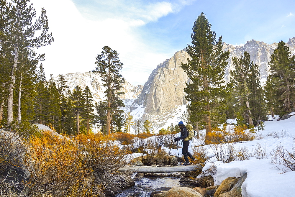 Crossing Big Pine Creek North Fork in John Muir Wilderness, Eastern Sierra Nevada, California.