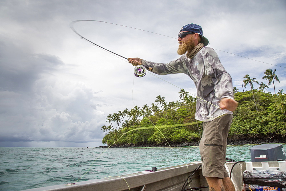 Angler Jonathan Jones casts while fly fishing for Giant Trevally while on location in Samoa.