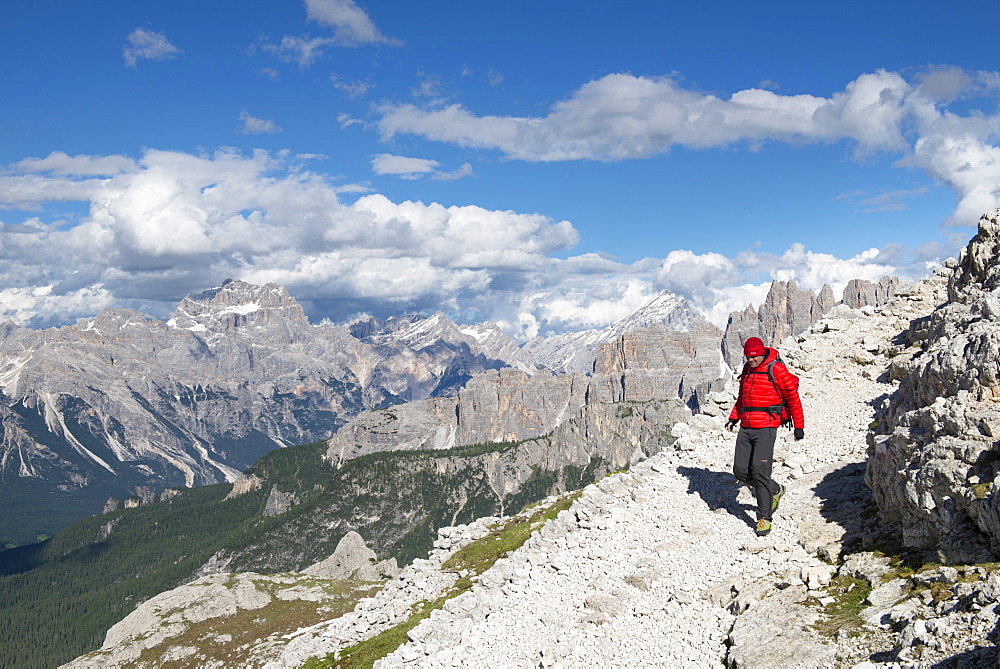 A Man Hiking From Rifugio Nuvaulau To Rifugio Averau