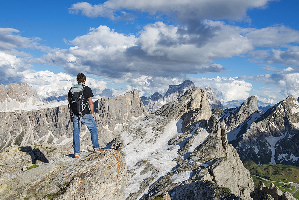 A Man Standing At The Top Of Nuvolau In The Dolomites, Italy