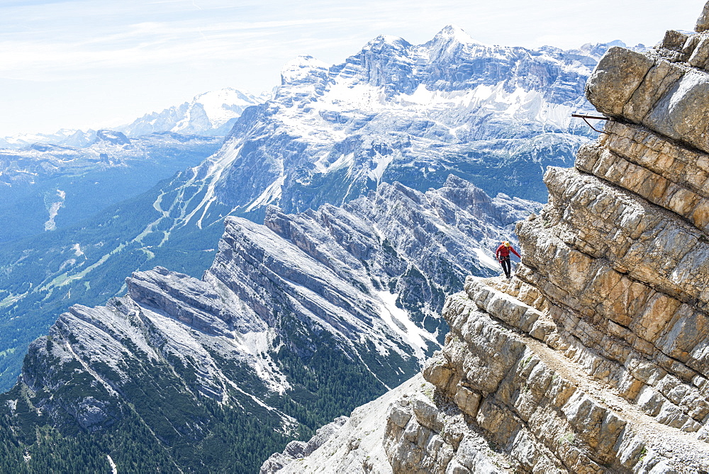 Man Climbing At The Via Ferrata Ivano Dibona In Dolomites, Italy