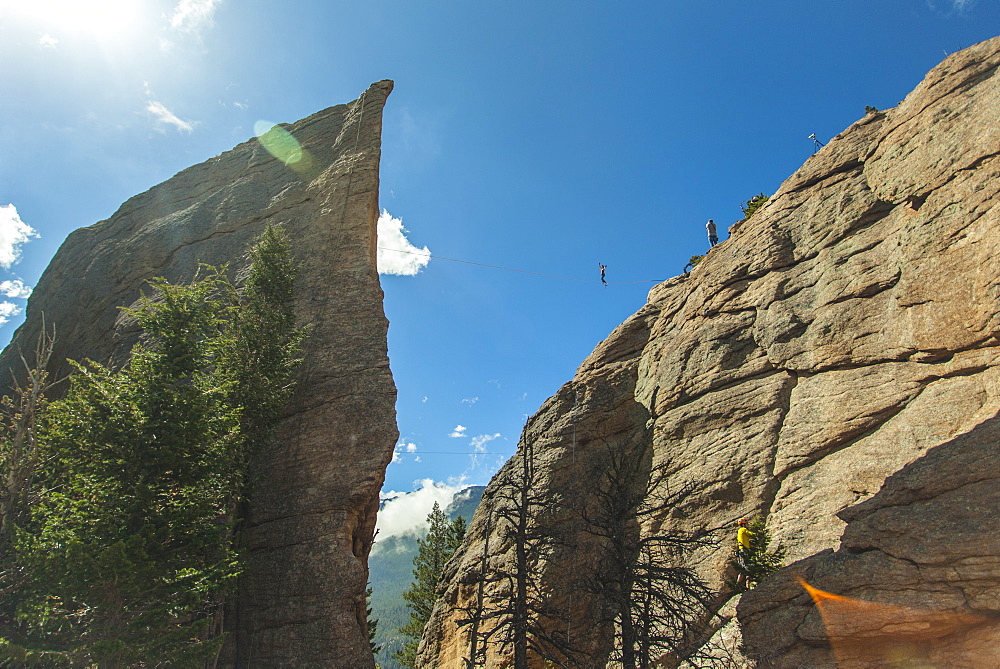 Long Exposure Of Man Walking On Slackline In Canyon