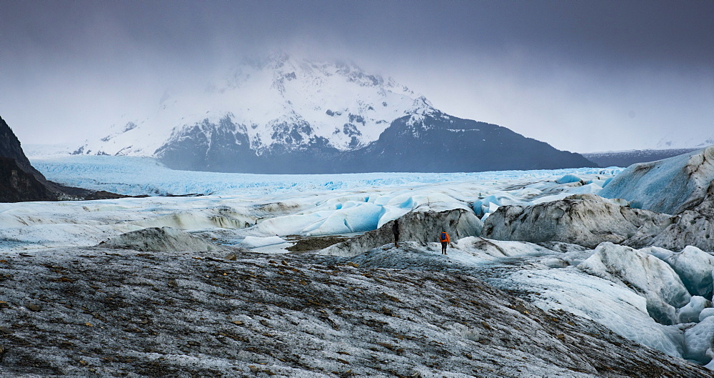 Long exposure of person trekking on the  Sheridan Glacier