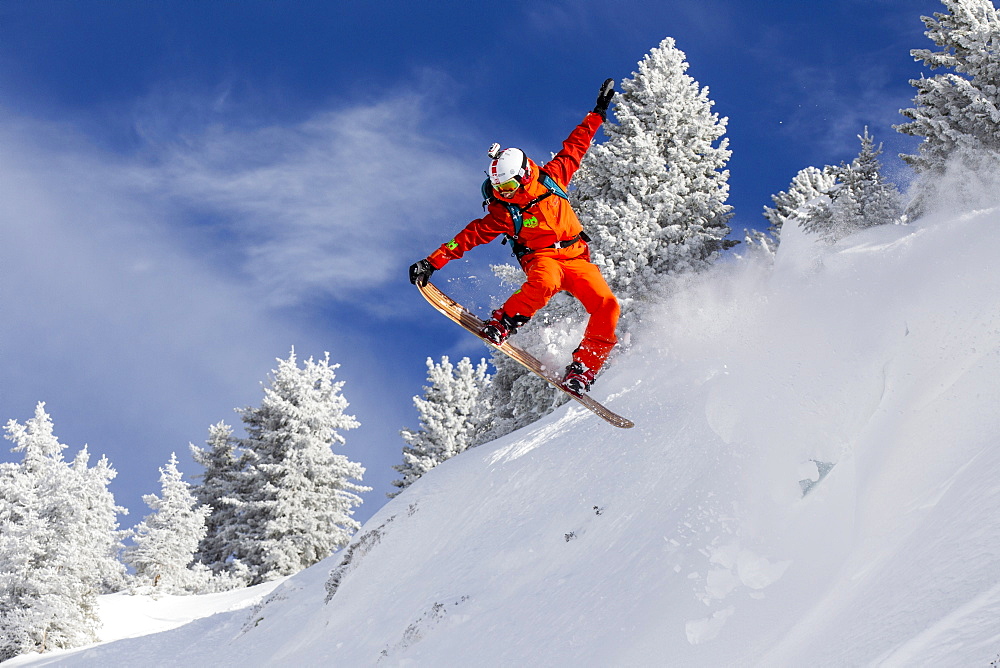 Person Snowboarding On Snowy Landscape In Chamonix Valley