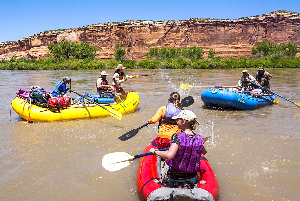 People Enjoying Water Fight While Rafting In The Colorado River