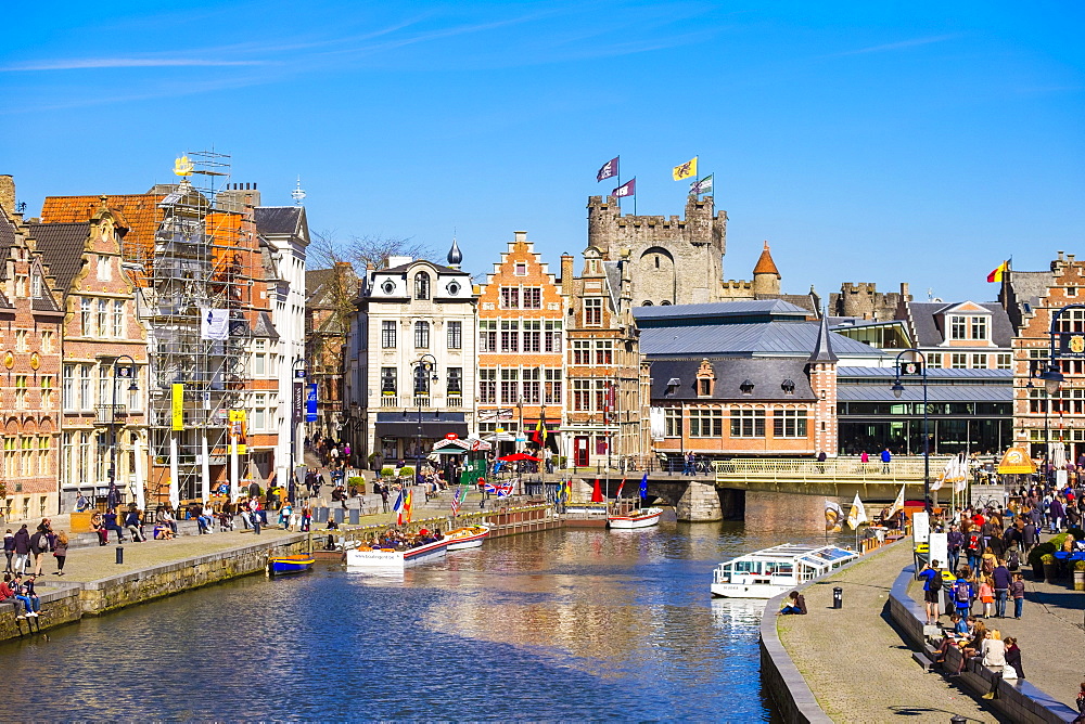 Gravensteen Castle And Buildings Along The Leie River And Korenlei Quay