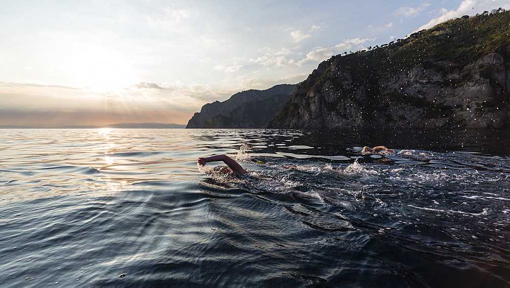 The Swimmers Swimming In The Mediterranean Sea During Sunset