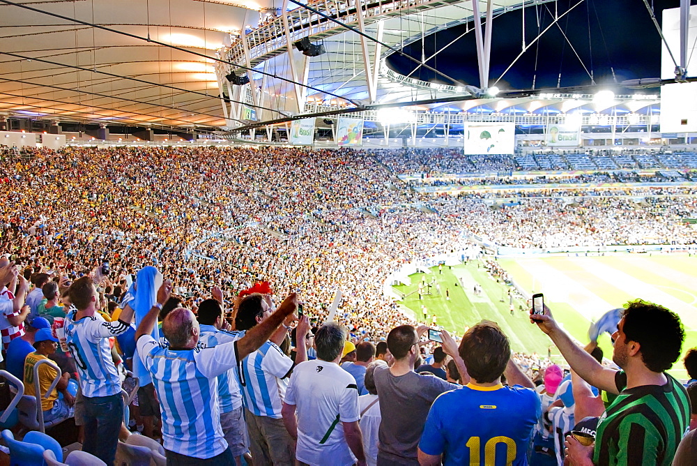 Soccer Fans Cheering And Taking Pictures With Their Smart Phones In Maracana Stadium