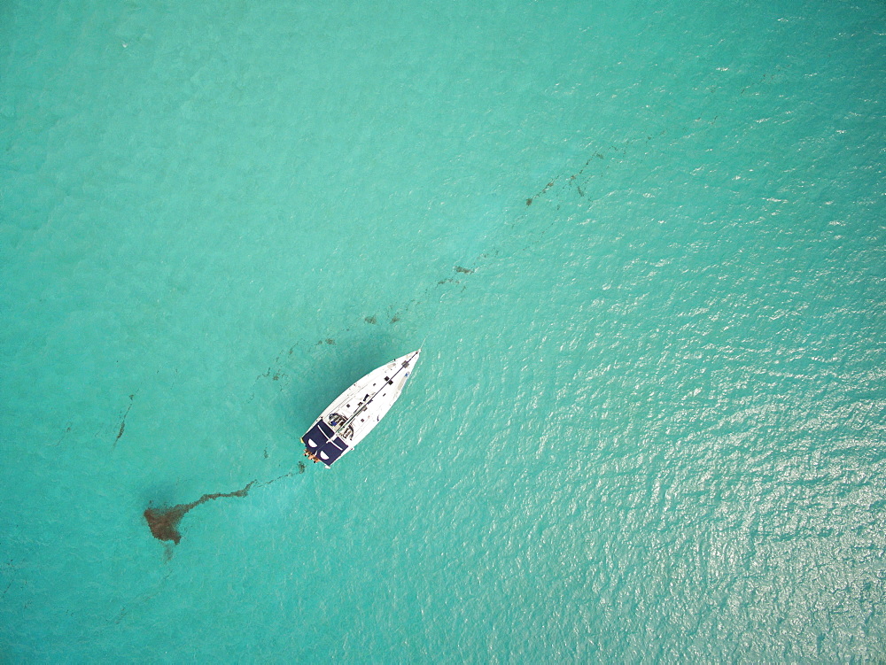 A Sailboat Rest In The Clear Waters Off The Coast Of The British Virgin Islands