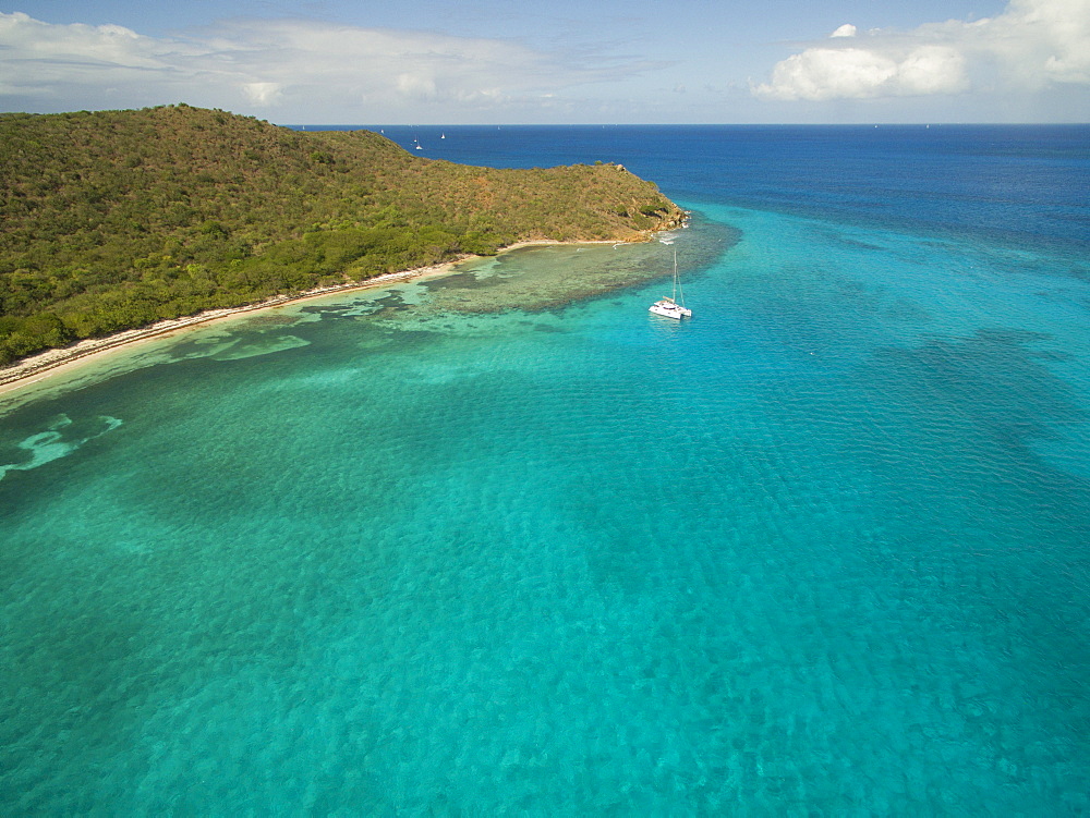 A Sailboat Rests In The Clear Waters Near Prickly Pear Island In The British Virgin Islands