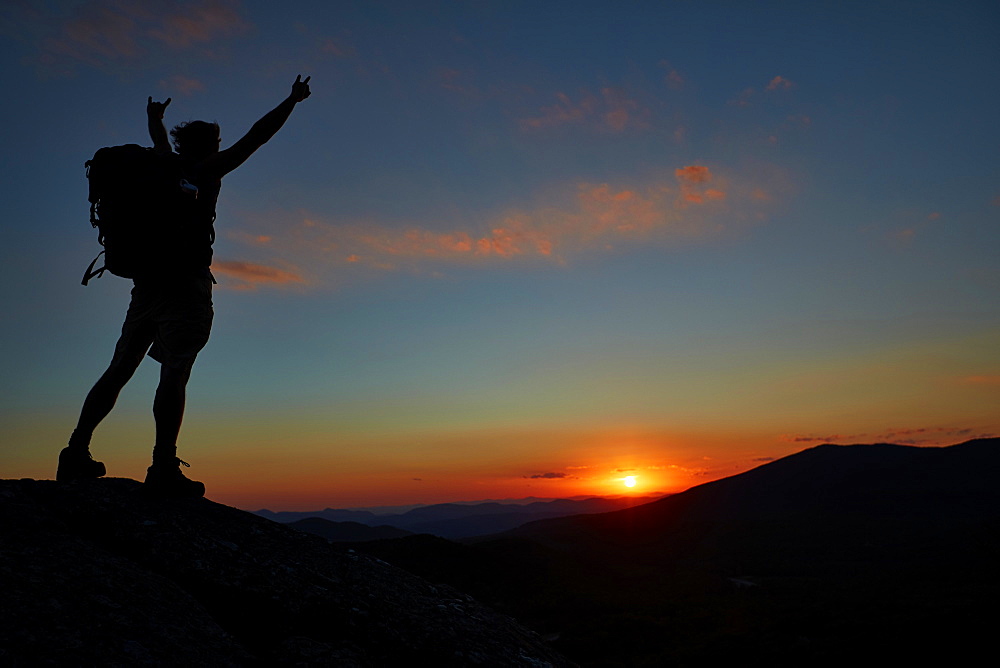 A Man Hikes Along The Appalachian Trail At Sunset