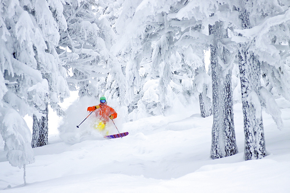 Male Skier Skiing On Snowy Landscape In Whitefish, Montana, Usa