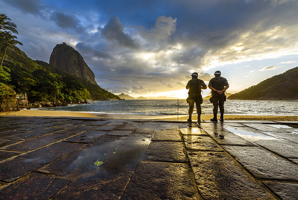 Two Military Soldiers At Praia Vermelha Beach During Sunrise