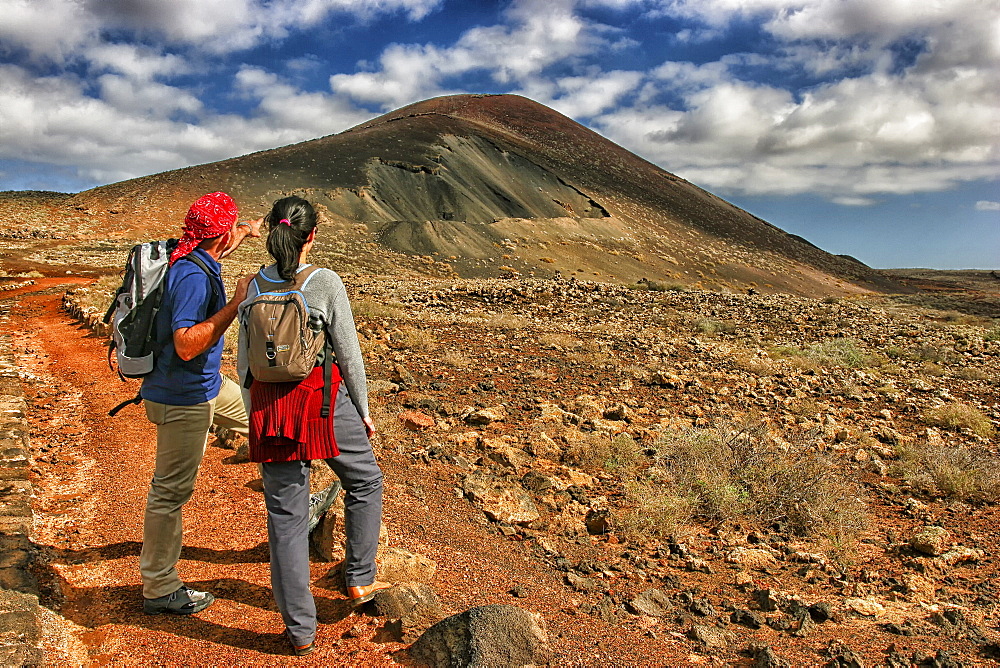 Hikers Exploring La Oliva Mountain In Fuerteventura Island Of Spain