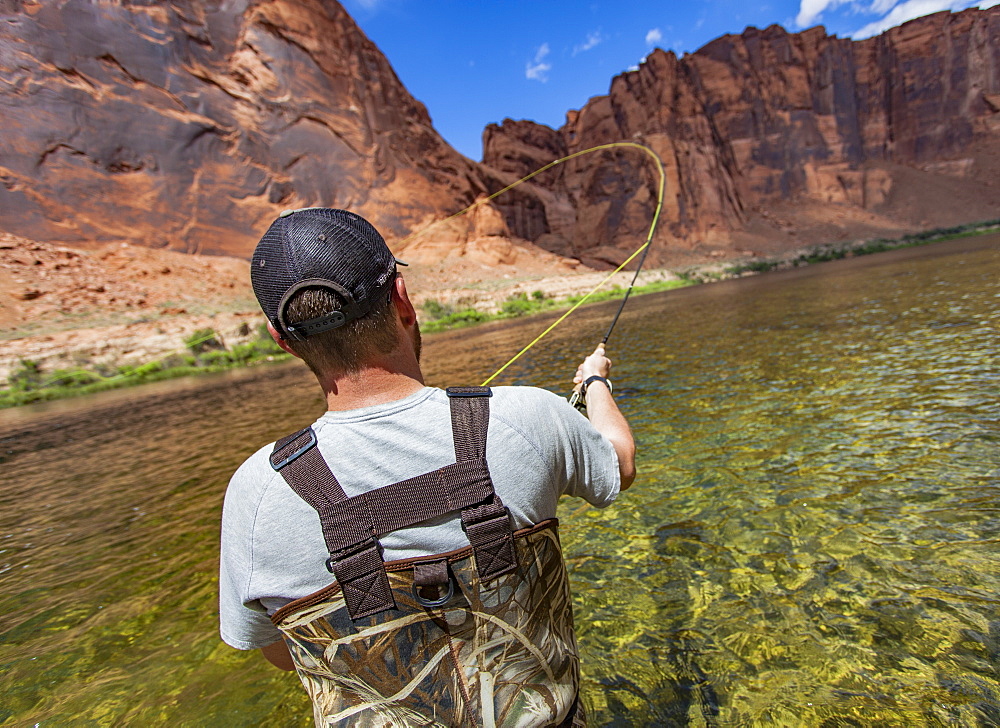 Man Casting In Horseshoe Bend On The Colorado River