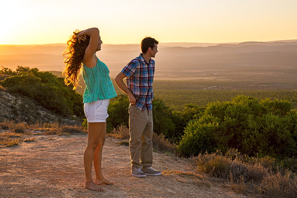 Man And Woman Watch The Sunset Over Addo Elephant National Park In South Africa