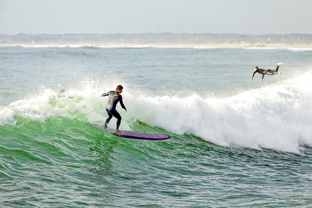 Surfboarding On The Waves Of Mediterranean Beach