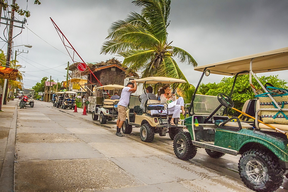 Convoy of golf carts in San Pedro, Belize