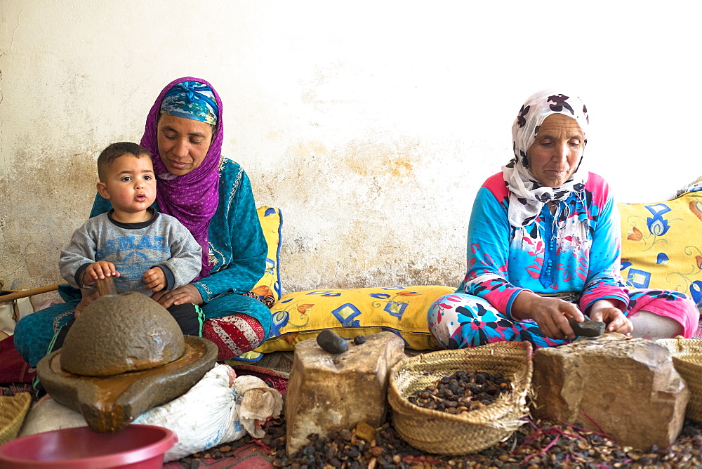 Two Berber Women In Traditional Clothing Extract Argan Oil From Kernels Of The Argan Tree