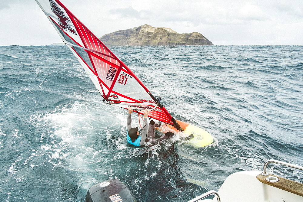 Man Windsurfing On Sea At Faroe Islands