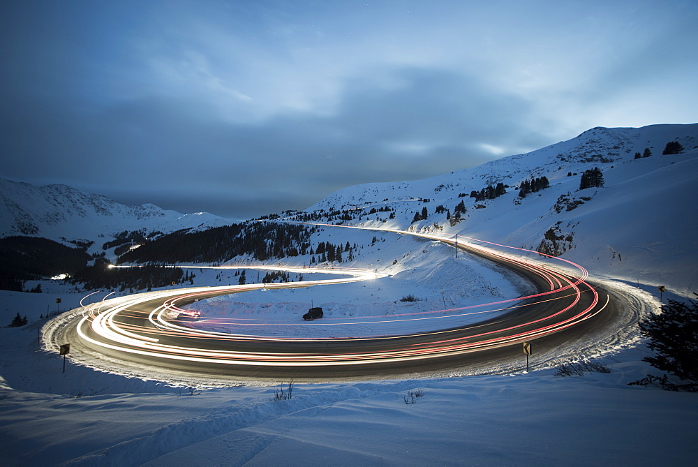 Trail Light Passing On Road In The Shape Of A Question Mark On Colorado Highway